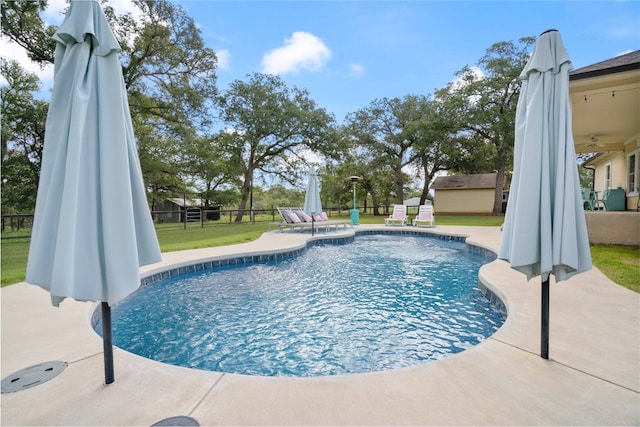 view of pool featuring ceiling fan and a patio