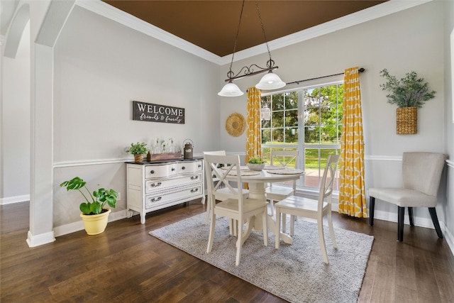 dining room featuring dark wood-type flooring and ornamental molding