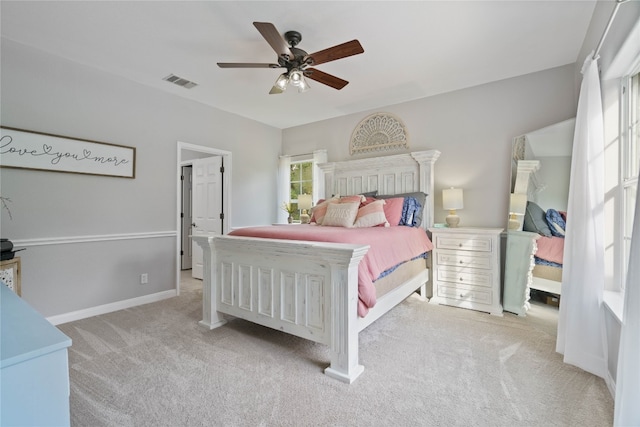 carpeted bedroom with ceiling fan