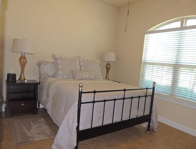 tiled bedroom with baseboards