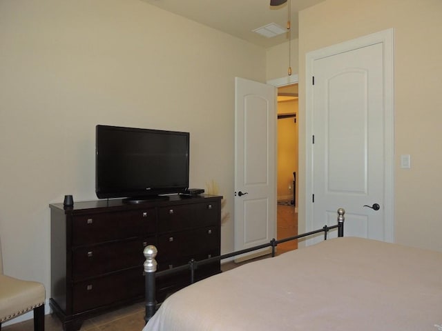 bedroom featuring light tile patterned flooring