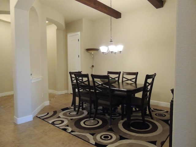 dining room with light tile patterned floors, a notable chandelier, baseboards, and beamed ceiling