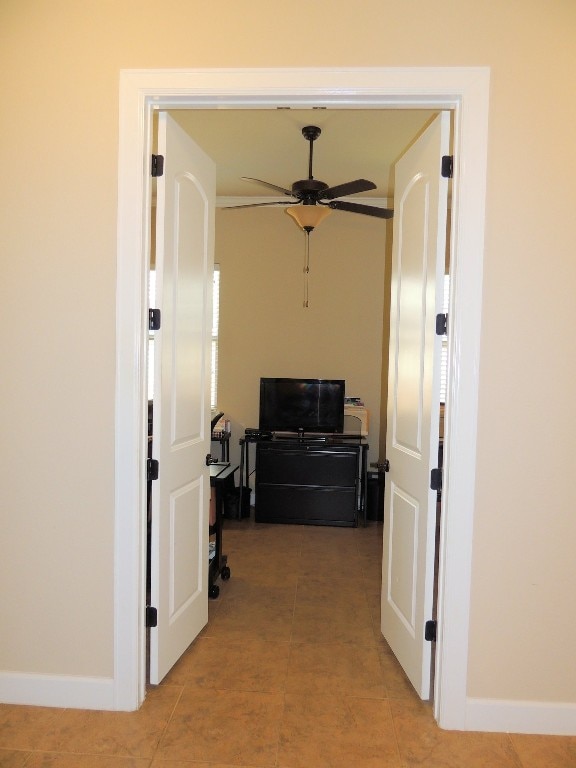 hall with light tile patterned floors