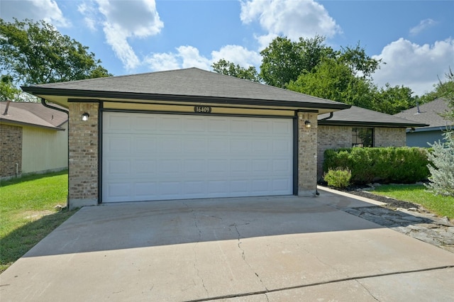 garage with concrete driveway