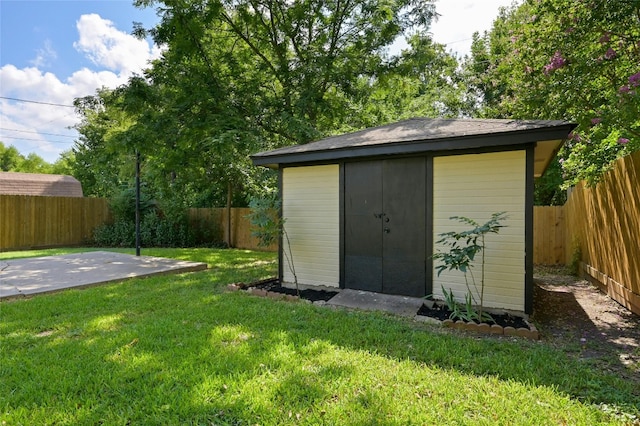 view of shed with a fenced backyard