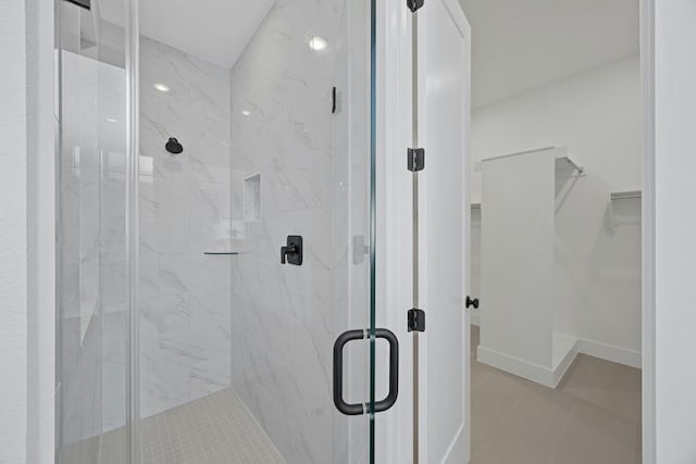 bathroom featuring tile patterned floors and walk in shower