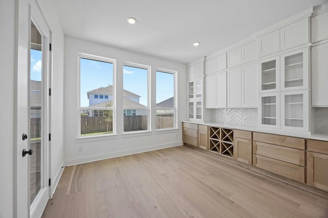 interior space with light wood-type flooring and plenty of natural light