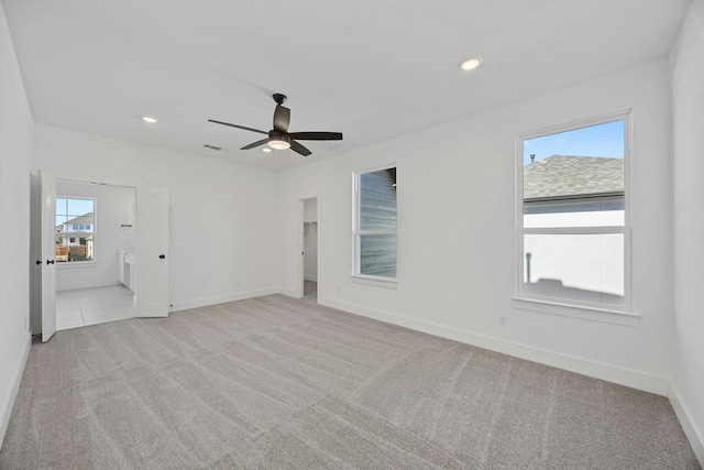 empty room with light carpet and ceiling fan