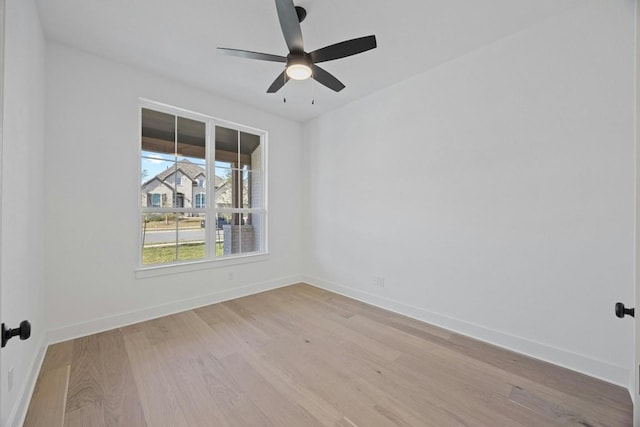 empty room featuring ceiling fan and light wood-type flooring