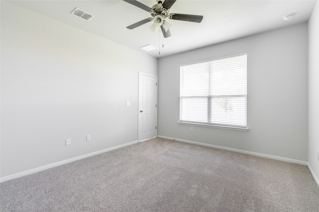 spare room with ceiling fan and carpet floors