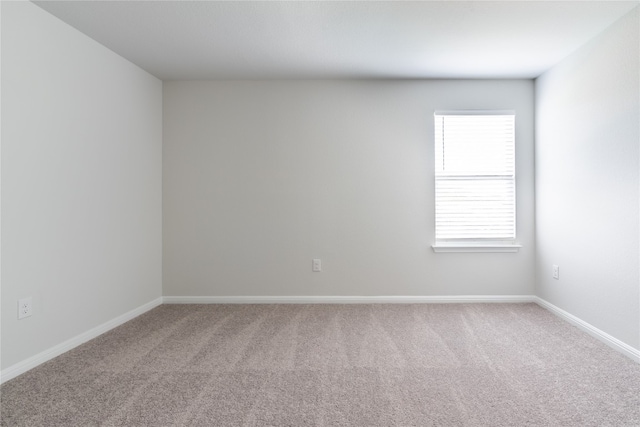 carpeted empty room with plenty of natural light