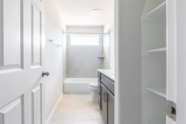 full bathroom with tiled shower / bath, vanity, toilet, and tile patterned flooring