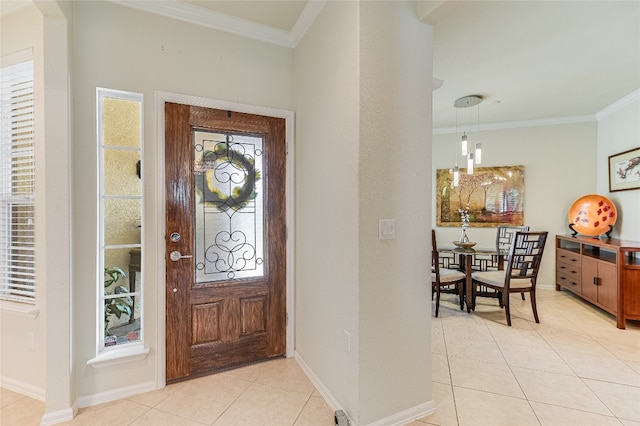 tiled entrance foyer with ornamental molding