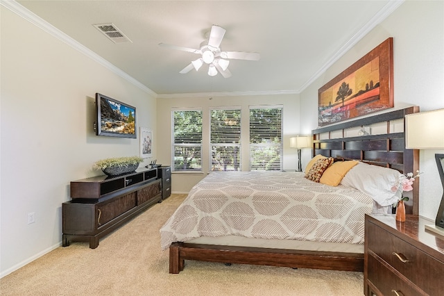 bedroom featuring ceiling fan, light colored carpet, and ornamental molding