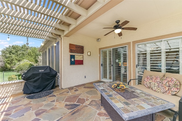 view of patio / terrace with ceiling fan, a pergola, and grilling area