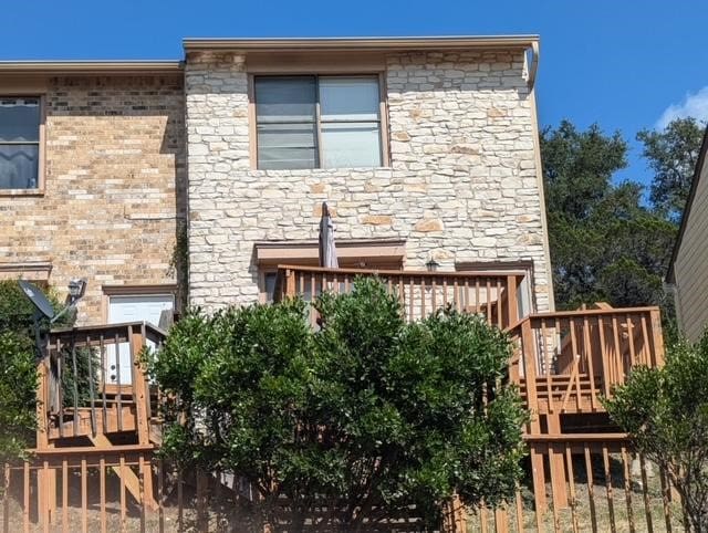 back of house featuring a deck