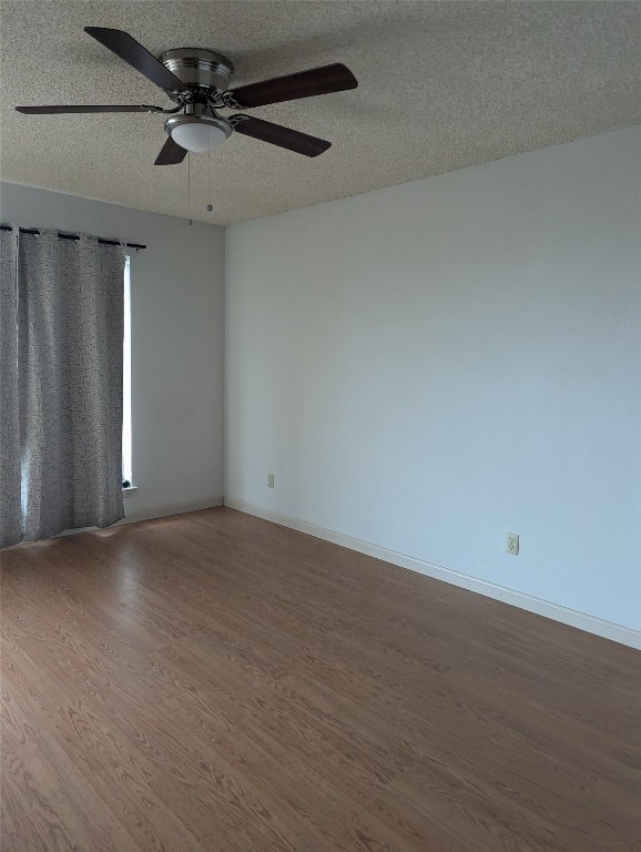 unfurnished room featuring hardwood / wood-style flooring, a textured ceiling, and ceiling fan