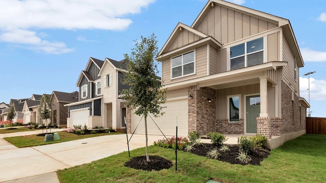 craftsman house featuring a garage and a front lawn