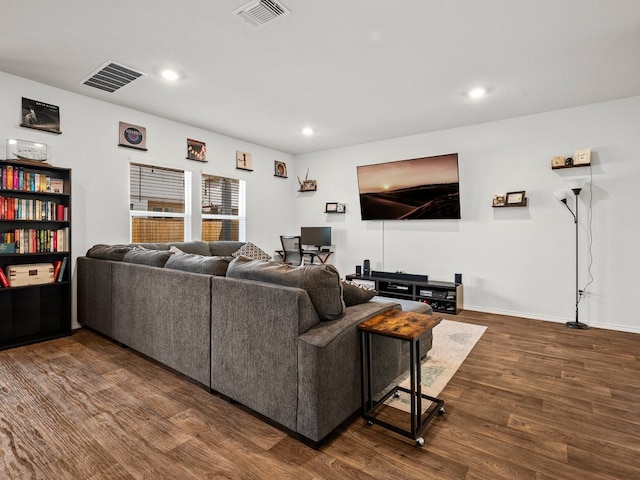 living room with dark hardwood / wood-style floors