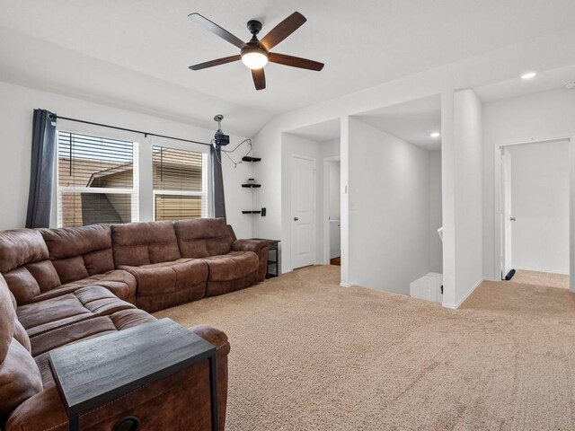 living room featuring ceiling fan and carpet flooring