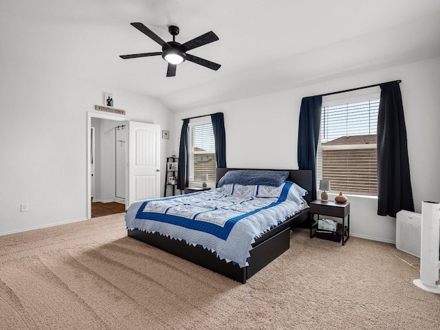 bedroom featuring lofted ceiling, carpet, a ceiling fan, and baseboards