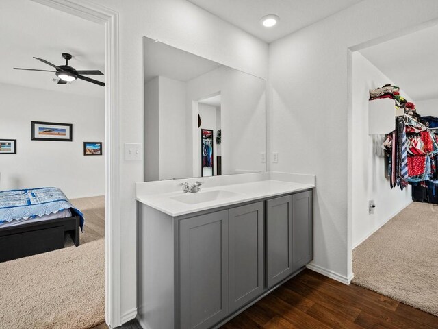 bathroom featuring vanity, wood-type flooring, and ceiling fan