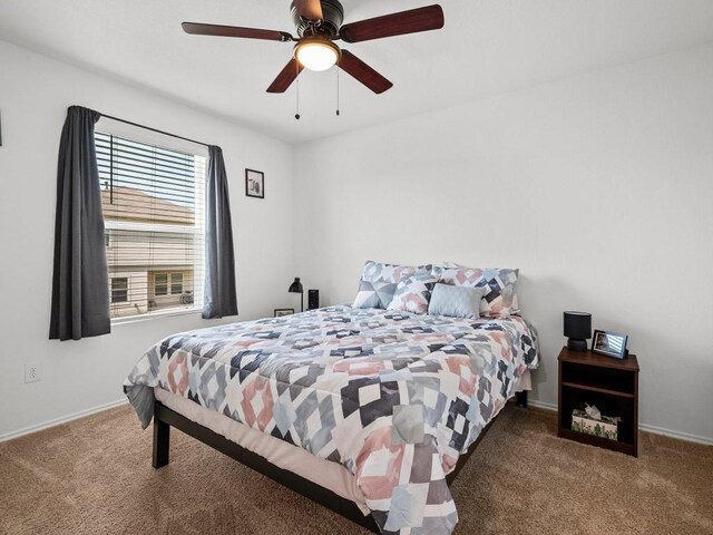 bedroom featuring ceiling fan and carpet flooring