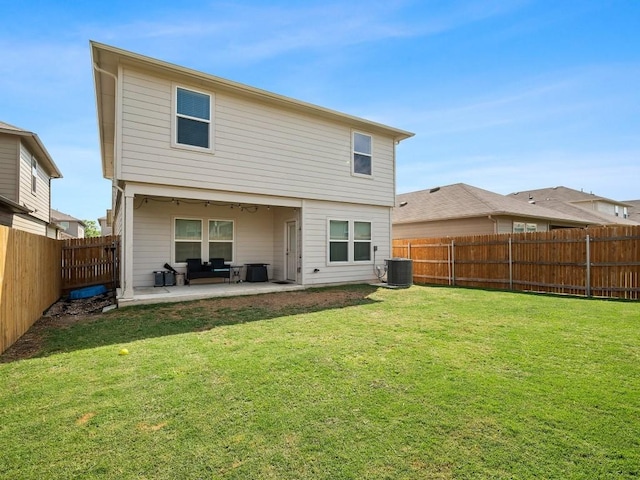 back of house with cooling unit, a patio area, a fenced backyard, and a yard