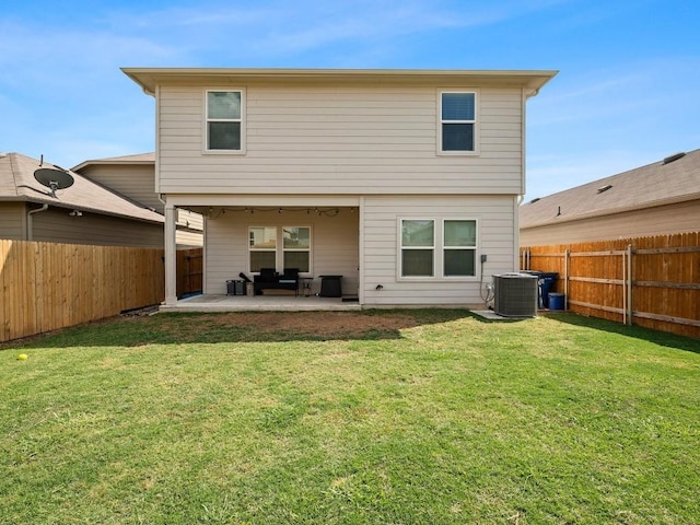 back of property with a patio, a lawn, cooling unit, and a fenced backyard