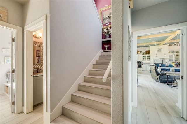 staircase featuring hardwood / wood-style floors