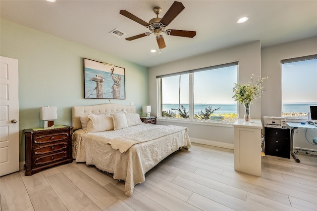 bedroom featuring ceiling fan and light hardwood / wood-style floors