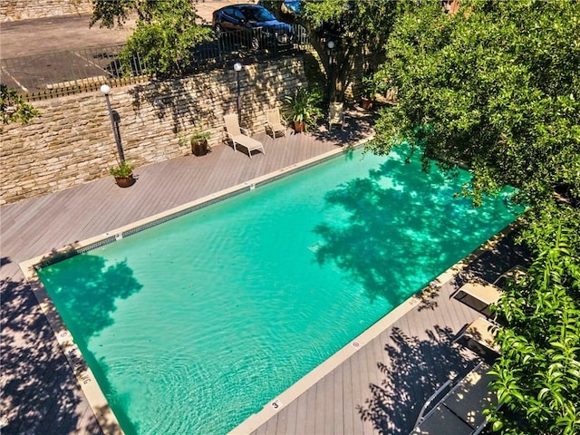 view of swimming pool with a wooden deck