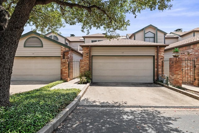 view of front of property featuring a garage and an outdoor structure