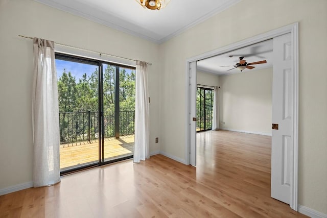 entryway with light hardwood / wood-style flooring, ornamental molding, and ceiling fan