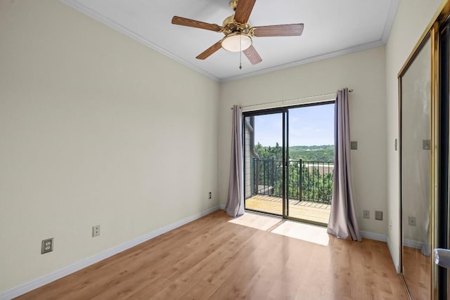 unfurnished room featuring ceiling fan, ornamental molding, and light wood-type flooring