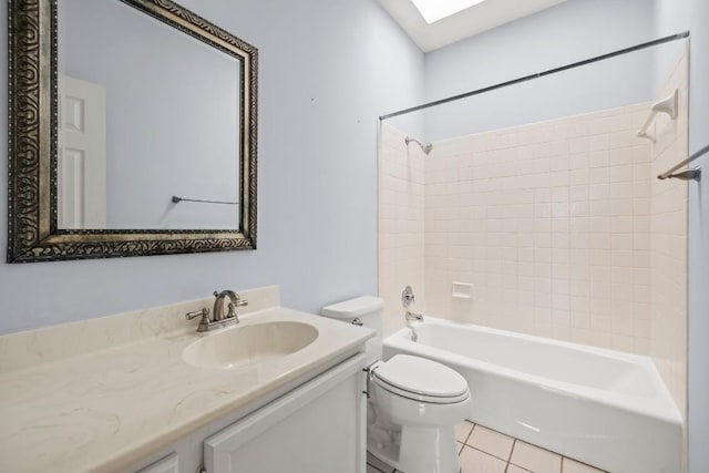 full bathroom with vanity, toilet, tiled shower / bath combo, and tile patterned flooring