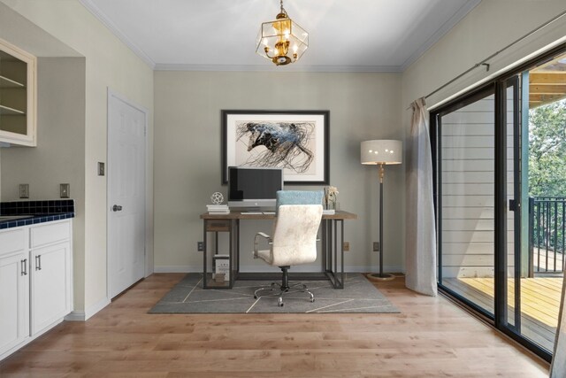 office area featuring a notable chandelier, light hardwood / wood-style flooring, and ornamental molding