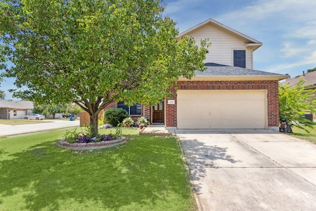 view of front of property featuring a front lawn and a garage