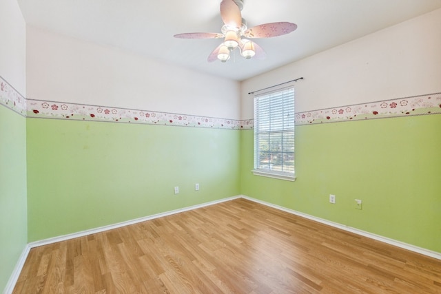 unfurnished room featuring ceiling fan and light hardwood / wood-style floors