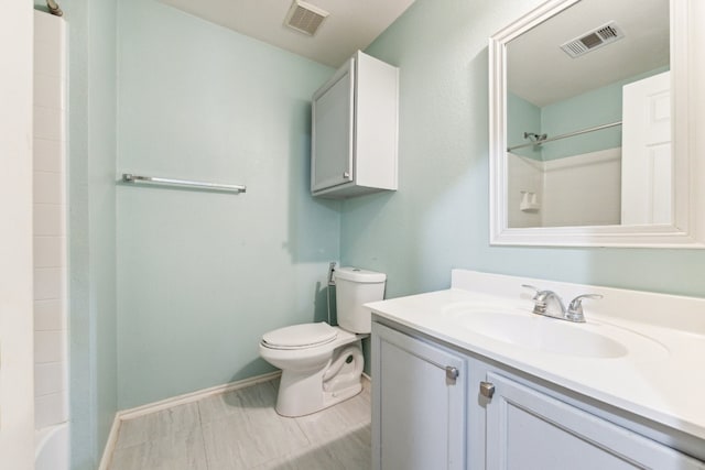 full bathroom with washtub / shower combination, toilet, tile patterned floors, and vanity