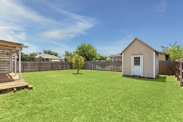 view of yard featuring a pergola and a storage shed