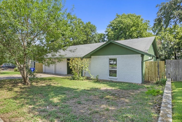 single story home with a front lawn and a garage