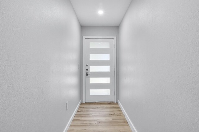 doorway to outside featuring light hardwood / wood-style flooring