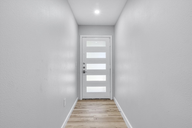 doorway with light hardwood / wood-style floors