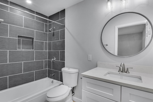 full bathroom with vanity, toilet, and tiled shower / bath