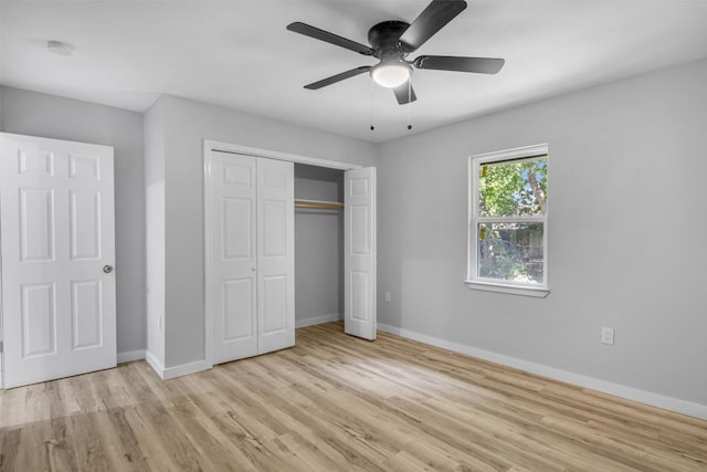 unfurnished bedroom with ceiling fan, light hardwood / wood-style floors, and a closet