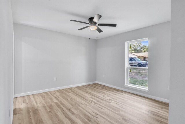 unfurnished room featuring ceiling fan and light hardwood / wood-style flooring