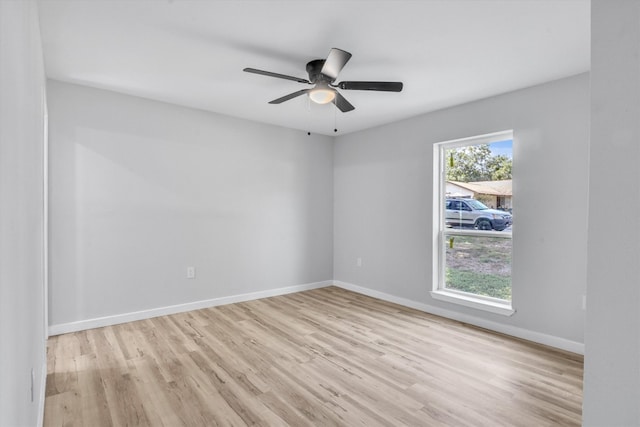 spare room featuring ceiling fan and light hardwood / wood-style floors