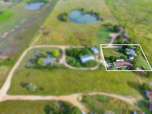 aerial view with a water view and a rural view