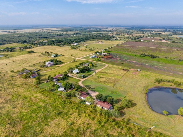 aerial view with a water view and a rural view